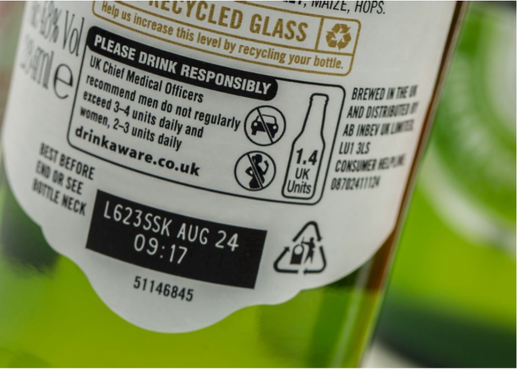 High-speed laser marking on beer bottle label with batch code and date