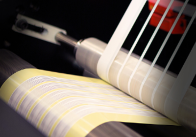 Luxinar CO2 lasers kiss cut self-adhesive labels Industrial CO2 laser machine kiss-cutting self-adhesive labels during continuous production
